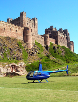 Charter flight to Bamburgh Castle in a Robinson R44